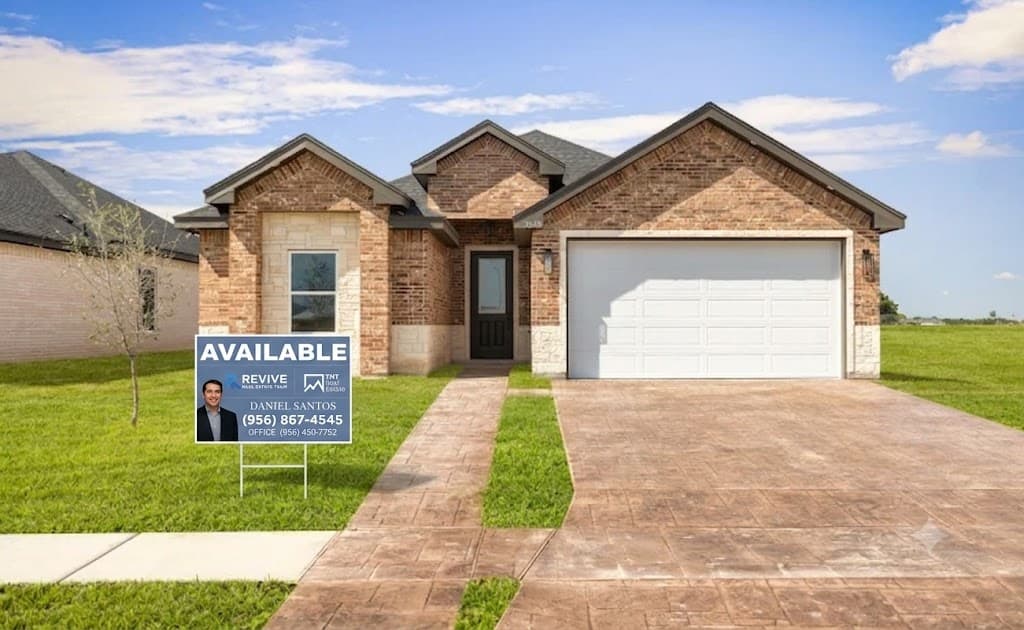 A Revive Real Estate Team "Available" yard sign in front of a home for sale